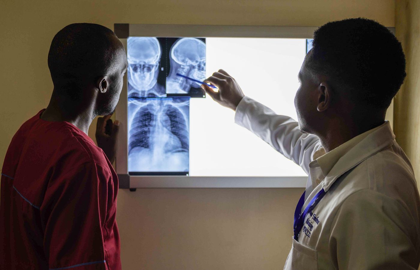 Orthopedic specialist reviewing X-ray imaging with a colleague